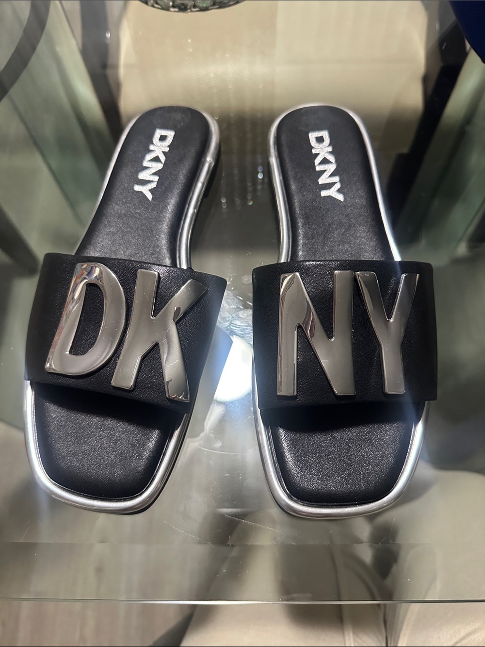 DKNY Black Slide Sandals with Silver Logo Hardware